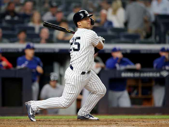Sep 22, 2021; Bronx, New York, USA; New York Yankees second baseman Gleyber Torres (25) follows through on an RBI double against the Texas Rangers during the eighth inning at Yankee Stadium.